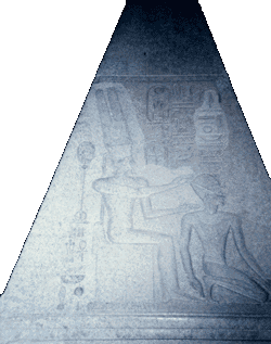 Hakim standing in front of a statue